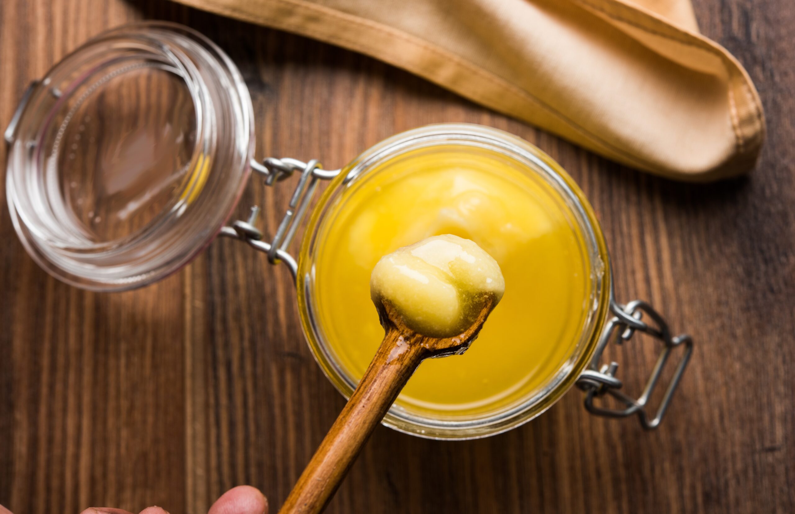 Pure ghee in a glass jar, highlighting its rich, golden texture and nutritional benefits, perfect for traditional and flavorful cooking in Kuwait - dairy products list